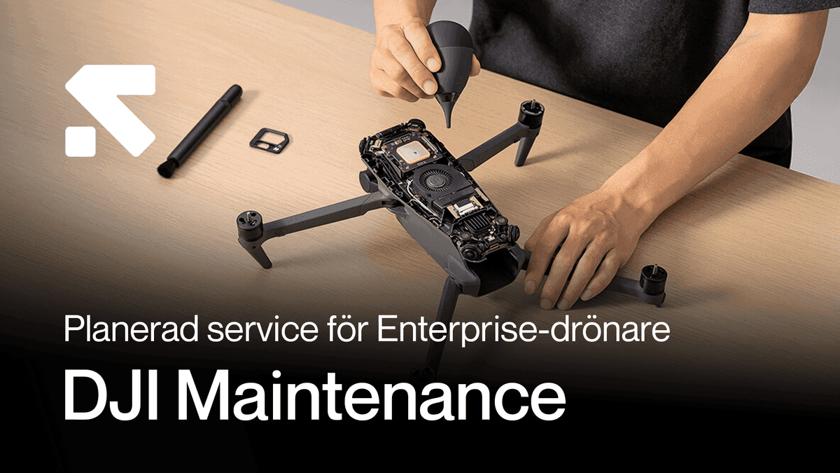 En person utför underhåll på en DJI-drönare, med verktyg och komponenter synliga på ett bord.