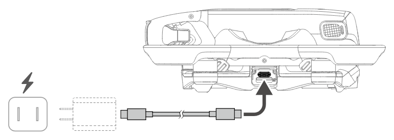 Drönaren laddas: en USB-C-laddare ansluts med kabeln till drönarens USB-C-port.