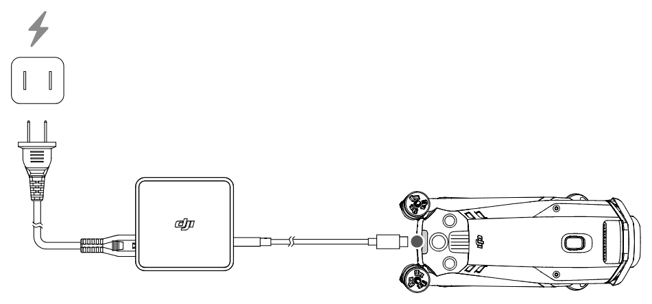 DJI USB-C Power Adapter (100W) ansluts till ett eluttag och med en USB-C-kabel till drönarens USB-C-port.